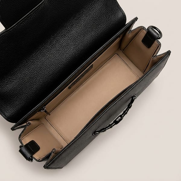 Black-structured-flap-shoulder-bag-with-gold-hardware-and-adjustable-crossbody-strap