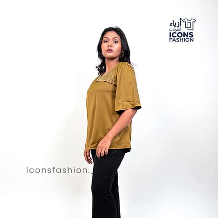 Mustard-yellow-satin-top-with-asymmetrical-mesh-and-embellished-detailing-near-the-neckline