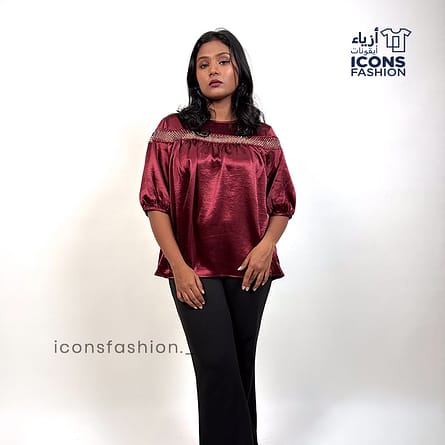 Wine-red-top-with-lace-detailing-across-the upper-chest-and-shoulders