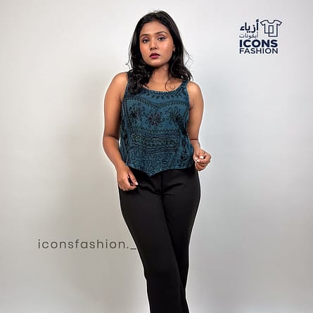 Teal-blue-spaghetti-strap-crop-top-for-women-floral-embossed-design-and-pointed-hem-casual-outfit