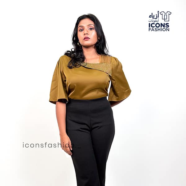 Mustard-yellow-satin-top-with-asymmetrical-mesh-and-embellished-detailing-near-the-neckline