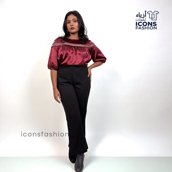 Wine-red-top-with-lace-detailing-across-the upper-chest-and-shoulders