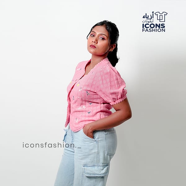 Baby-pink-short-sleeve-embroidered-top-with-scalloped-edges-and-delicate-floral-patterns