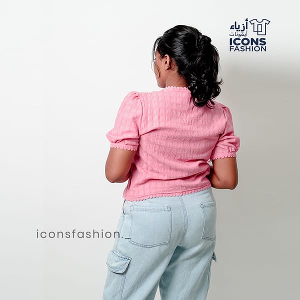 Baby-pink-short-sleeve-embroidered-top-with-scalloped-edges-and-delicate-floral-patterns