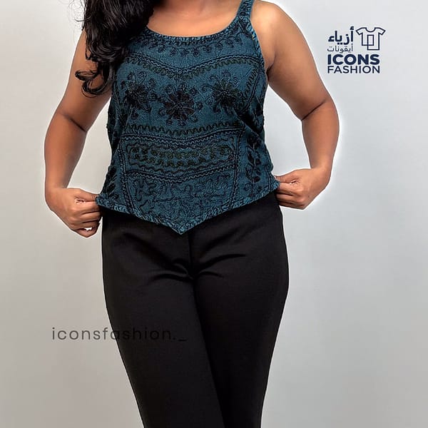 Teal-blue-spaghetti-strap-crop-top-for-women-floral-embossed-design-and-pointed-hem-casual-outfit