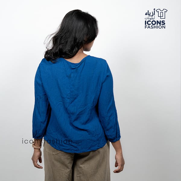 Woman-navy-blue-3/4-sleeve-embroidered-boho-top-with-v-neck-and-relaxed-fit