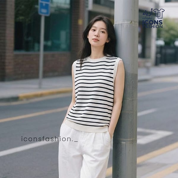 Women-wearing-black-and-white-striped-sleeveless-shirt-with-round-neck
