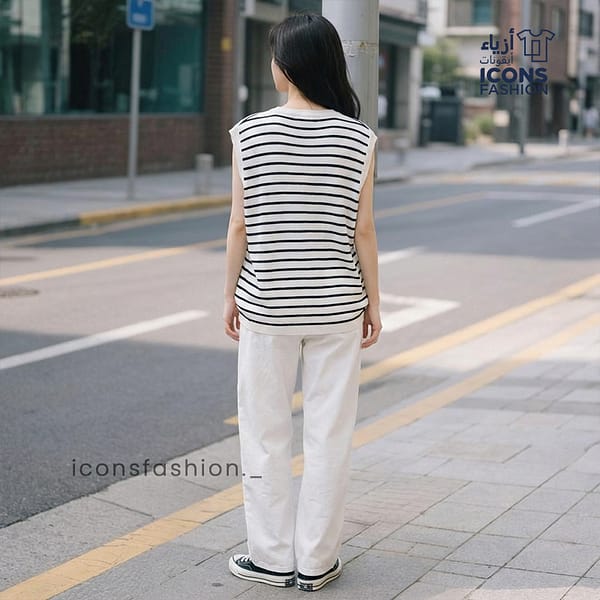 Women-wearing-black-and-white-striped-sleeveless-shirt-with-round-neck