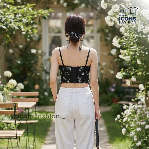 Black-camisole-top-with-floral-embroidery-sweetheart-neckline-and-spaghetti-straps