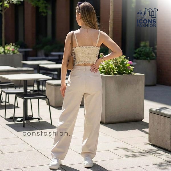 Woman-wearing-peach-floral-square-neck-crop-top-with-spaghetti-straps