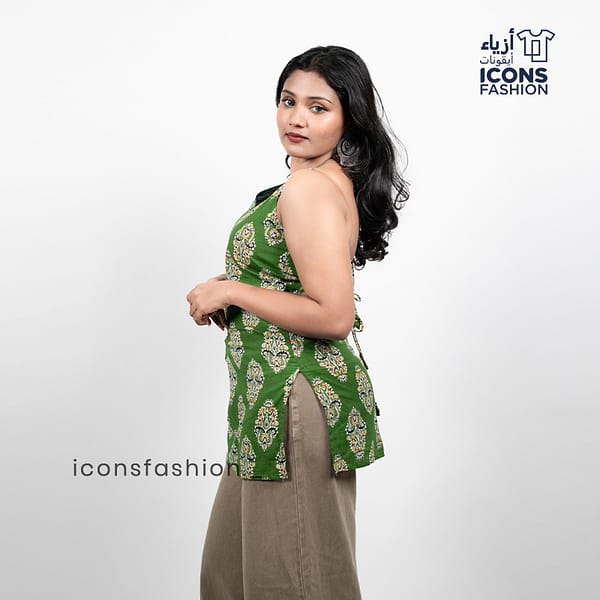 Woman-green-paisley-printed-sleeveless-halter-neck-kurta-with-open-back-and-tie-up-detail