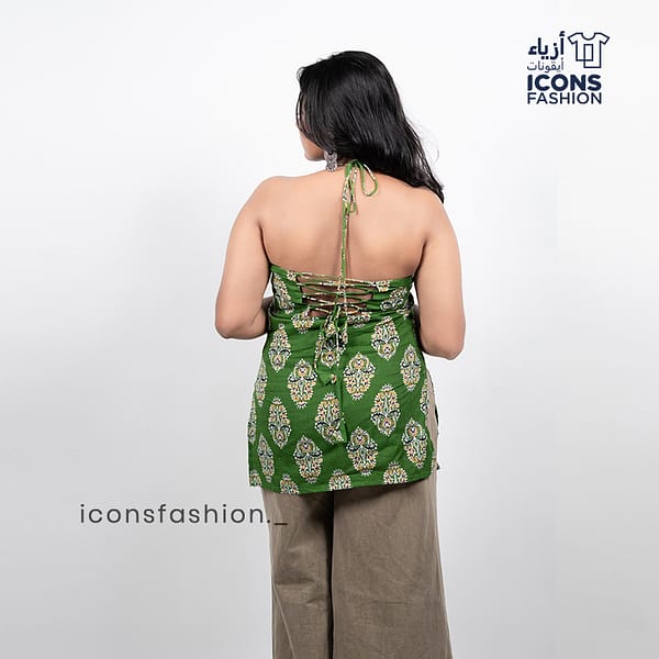 Woman-green-paisley-printed-sleeveless-halter-neck-kurta-with-open-back-and-tie-up-detail