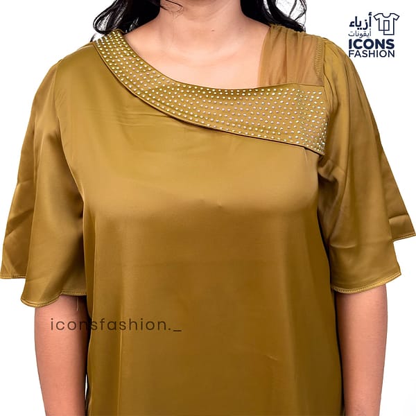 Mustard-yellow-satin-top-with-asymmetrical-mesh-and-embellished-detailing-near-the-neckline